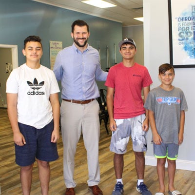 Chiropractor-Jason-O'Rear-with-Patients Chiropractor Covington LA Jason O'Rear with Patients